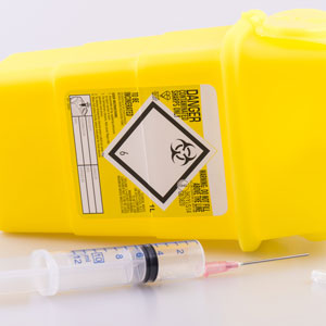 Hyperdermic needle and sharps box